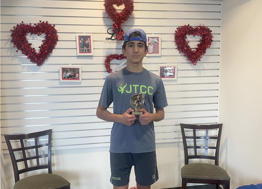 Eighth-grader Zaid Zamani after winning the Indoor Doubles Championship Hosted by Virginia Beach Tennis. (Courtesy of Zaid Zamani)